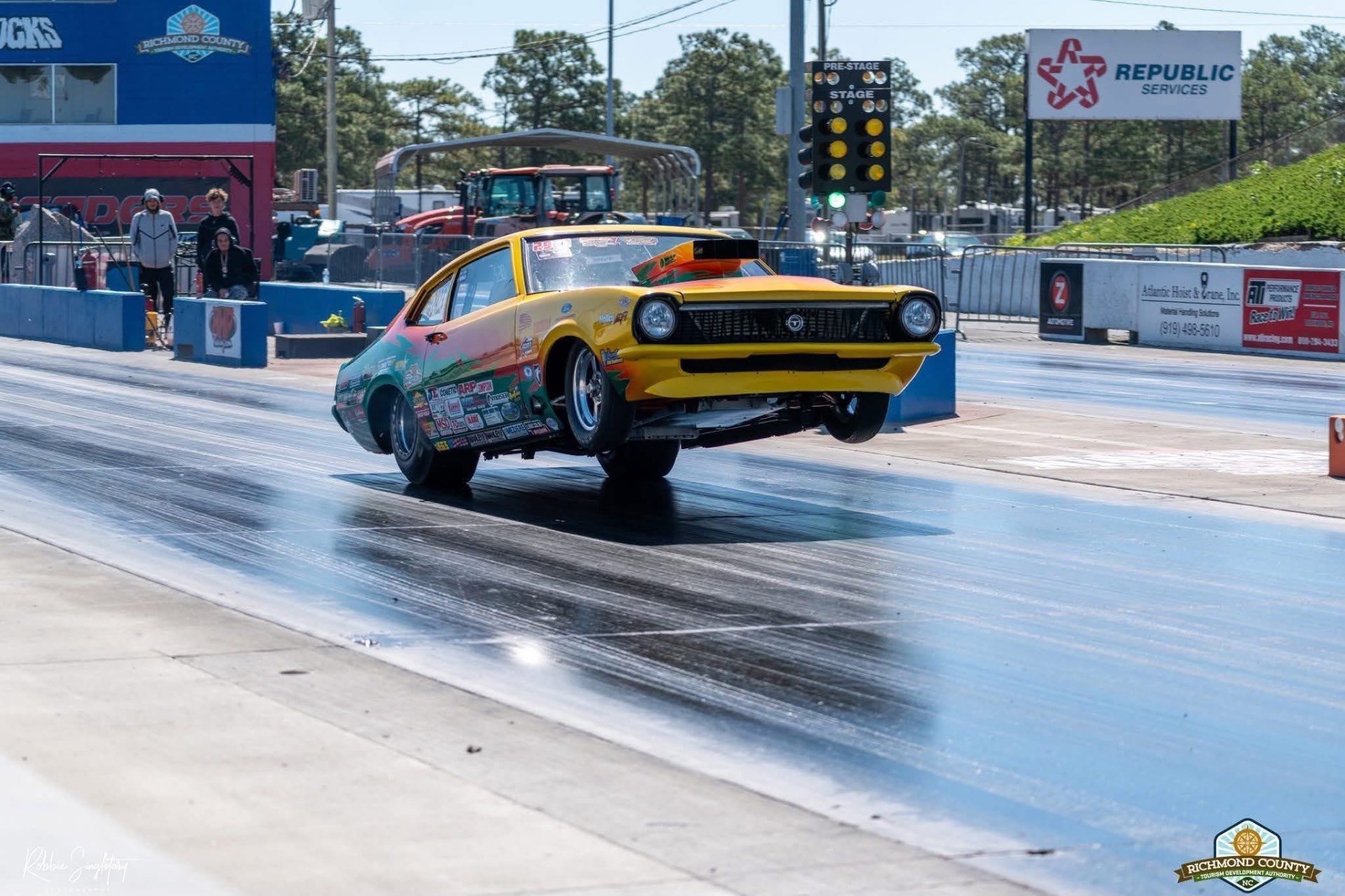 Outcasts race car launching wheels-up off the tree